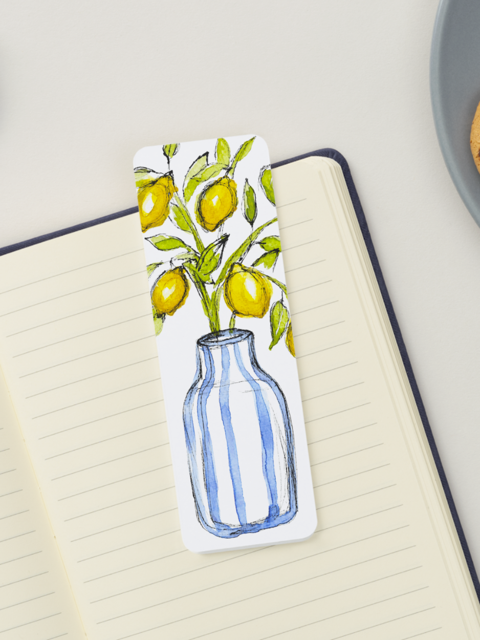 Bookmark of a blue striped vase with lemons on a notebook