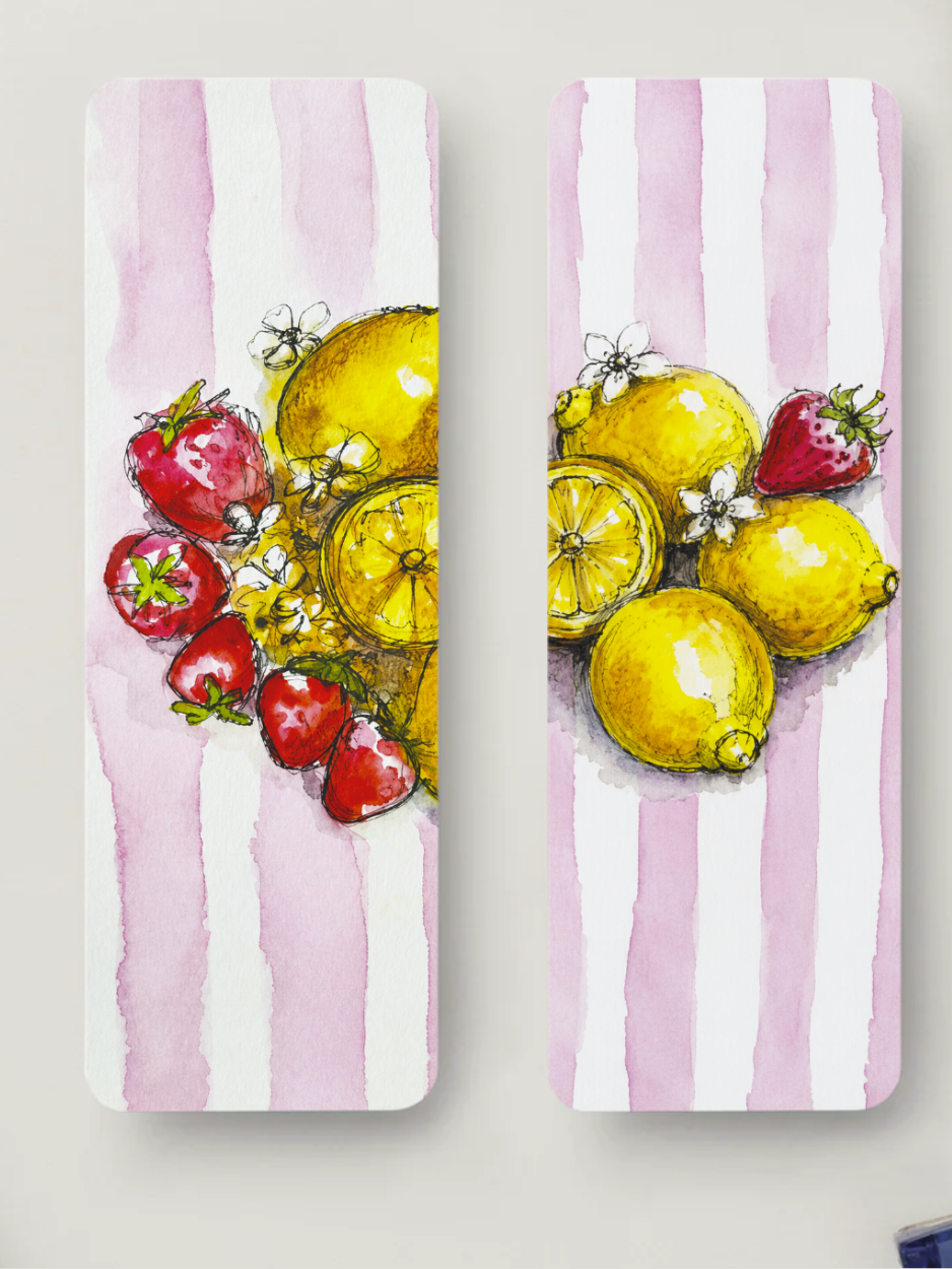 Two narrow vertical bookmarks with a watercolor-style fruit design. The left panel shows red strawberries and yellow lemons on a pink-and-white striped background, and the right panel shows a similar arrangement of lemons, strawberries, and small white flowers.